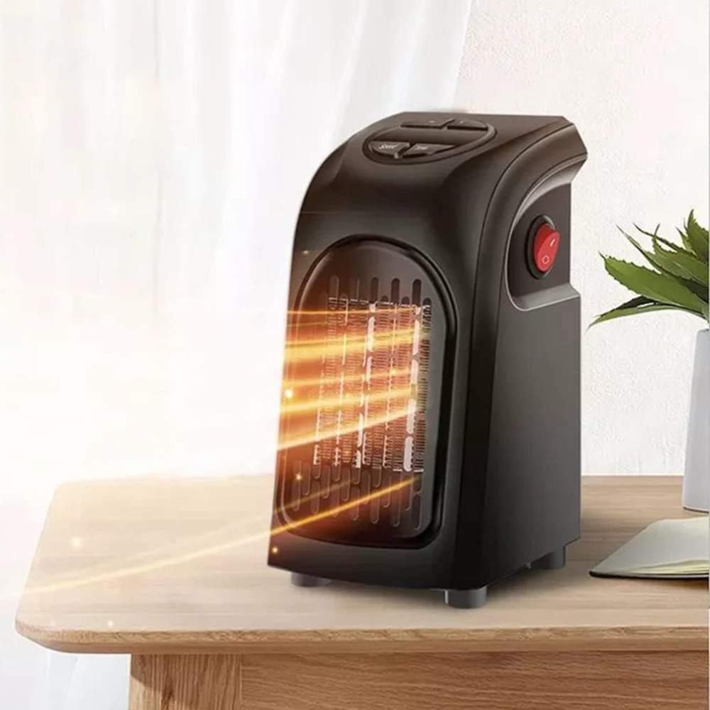 Close-up of the digital display and intuitive controls on the compact TavvitaImp010 fan heater thermostat.