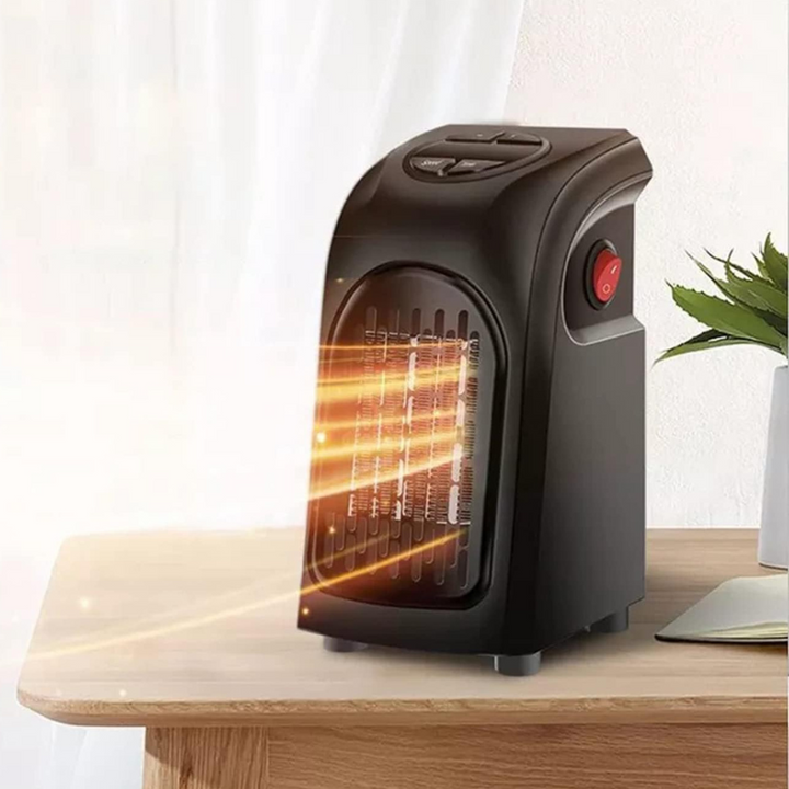 Close-up of the digital display and intuitive controls on the compact TavvitaImp010 fan heater thermostat.