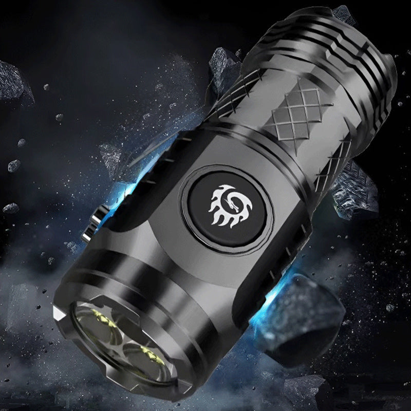 Rechargeable LED flashlight in an outdoor setting, demonstrating its practical use as camping gear