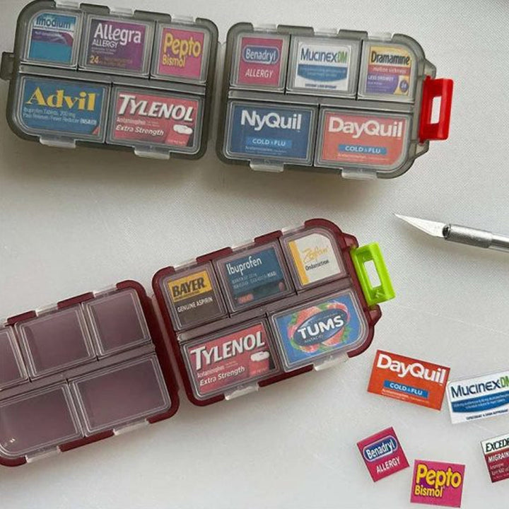 Pill organizer for travel, featuring 161 labels for easy identification of medications.