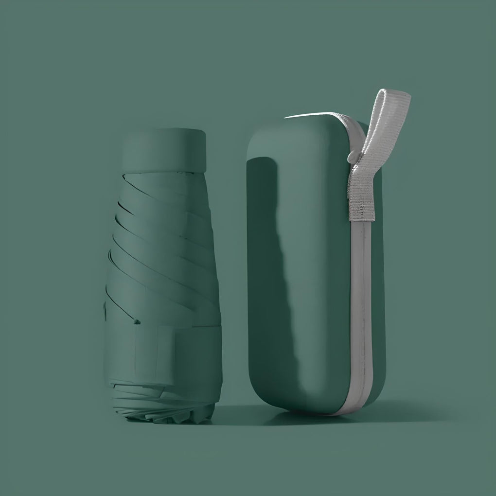 Mini foldable umbrella in its waterproof case, designed for compact and easy travel.