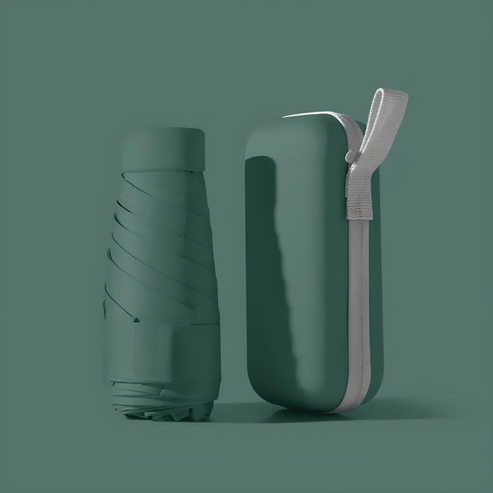 Mini foldable umbrella in its waterproof case, designed for compact and easy travel.
