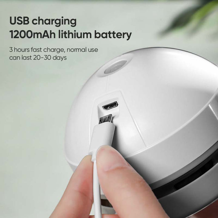 Portable mini vacuum cleaner in white, powered by USB, perfect for desk tidiness.