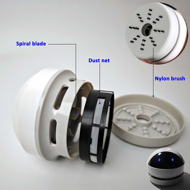 Portable white mini vacuum, designed for easy cleanup of crumbs and dust on desks.