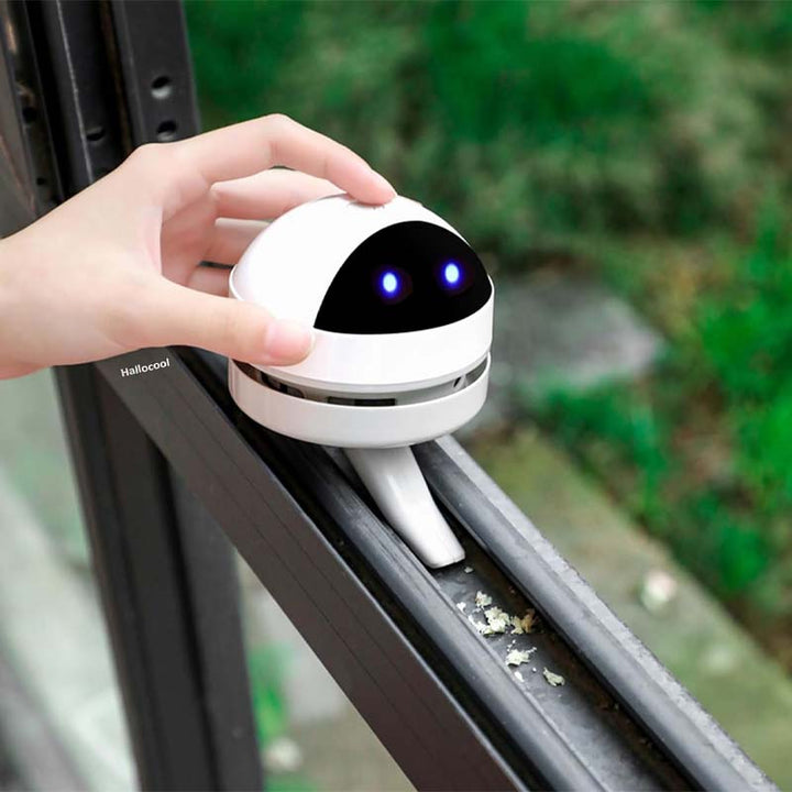 Small white portable vacuum, showing its lightweight design and easy handling.