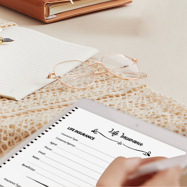 Person writing in the End-of-Life Planner, actively engaging in personal records and legacy planning.