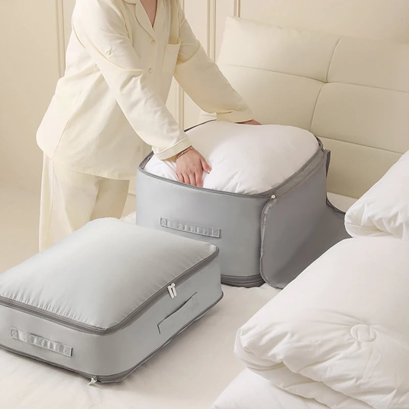 Compression bag for bedding, partially zipped to show the space-saving functionality for duvets