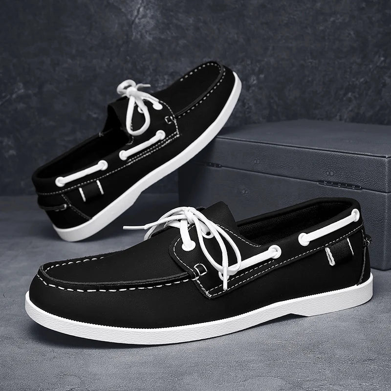 Corvan men's deck loafers beside a compass, emphasizing the nautical style and adventure-ready feel.