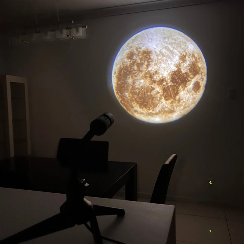 Night light projector lamp creating a space decor ambiance, featuring planets and stars for home decor.