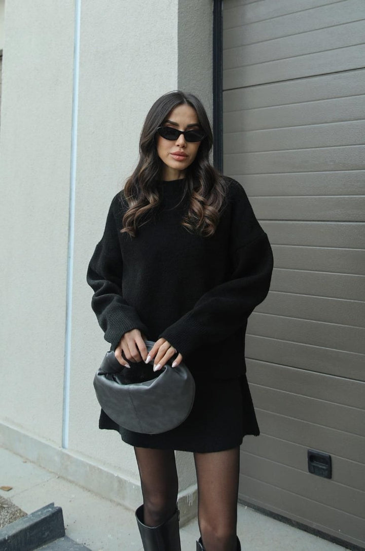 Women's two-piece knitwear set featuring a long-sleeve sweater and a short mini skirt.