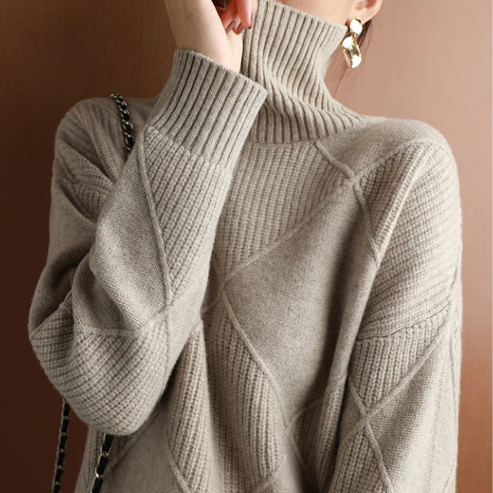 Women's oversized ribbed knit sweater paired with jeans for a casual, cozy look
