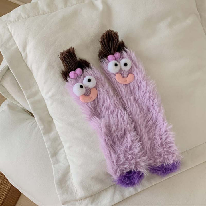 Adorable women's cartoon monster socks, super soft and fluffy, for cozy winter days.