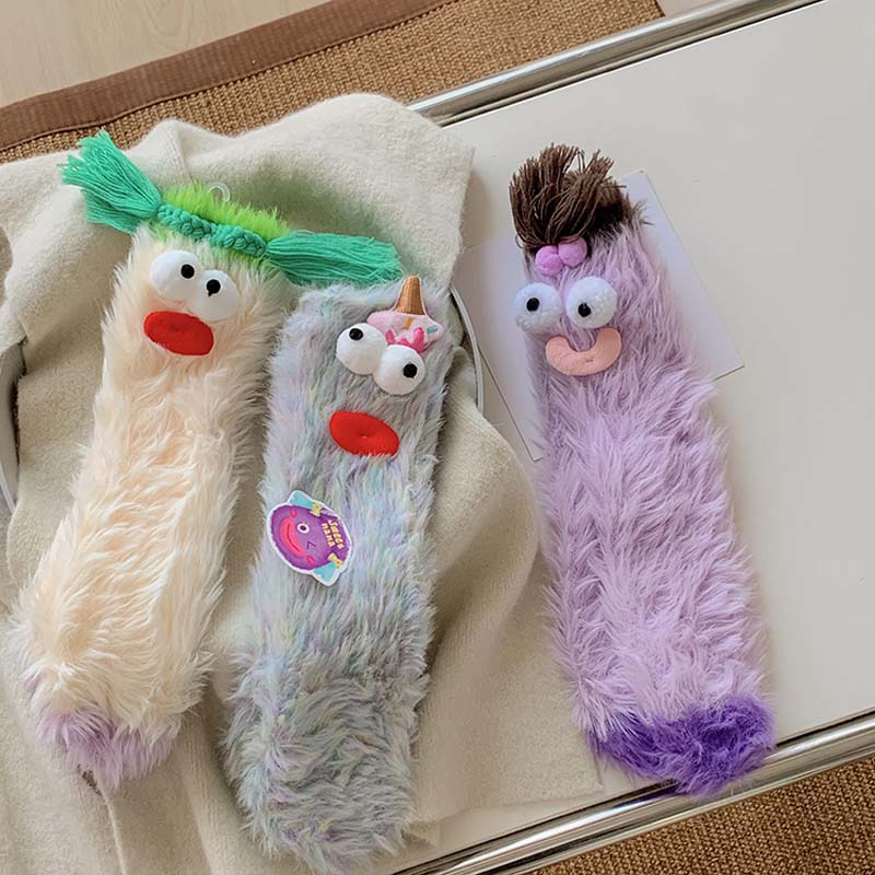 Vibrant women's fluffy cartoon monster socks, comfortable and stylish for winter.