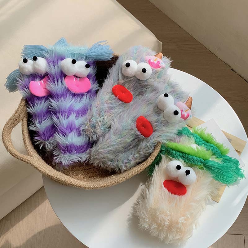 Women's warm monster socks, fluffy texture, cute cartoon eyes, perfect for cold weather.