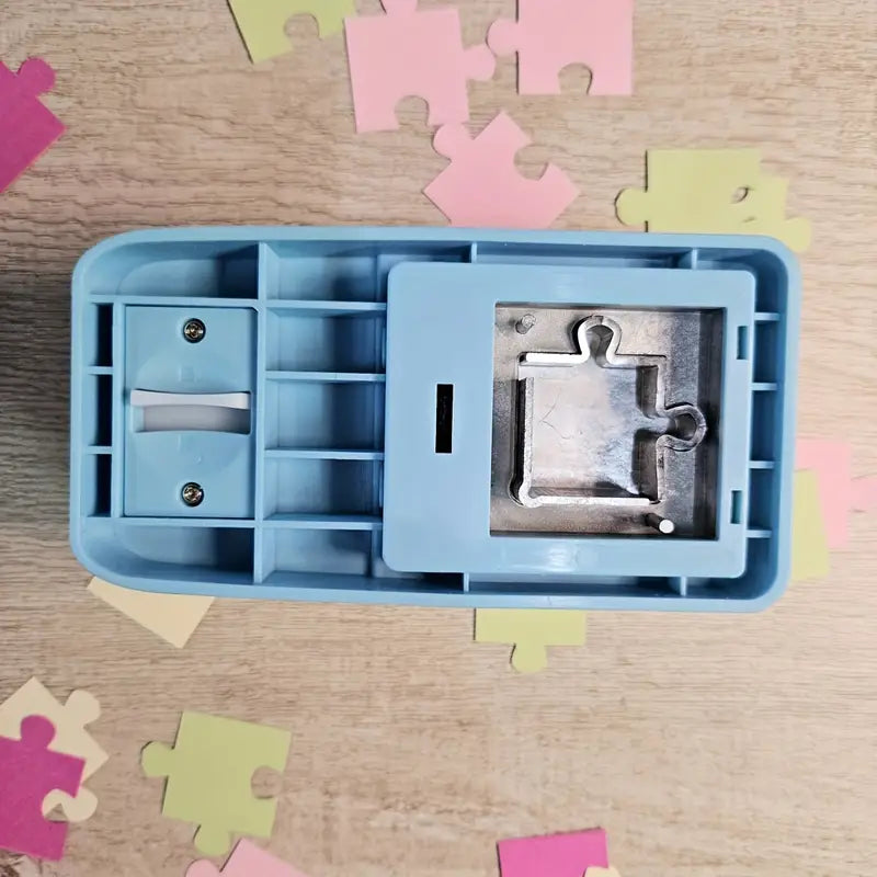 Hand holding a Crafting Jigsaw Puzzle Punch, demonstrating its use for DIY creative projects