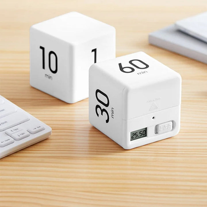 Compact cube timer, black, digital display counting down, a desk productivity accessory