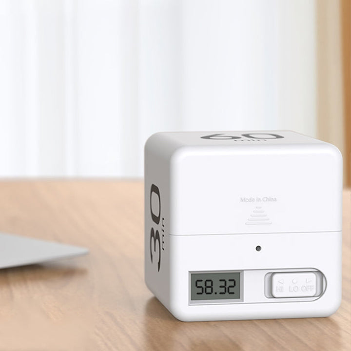 Student using a cube timer for focused study session, improving time management