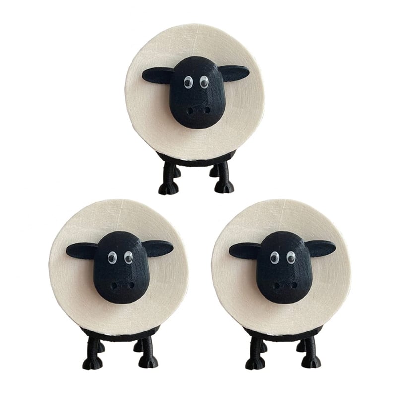Hand placing a toilet paper roll onto a black sheep holder, demonstrating easy access & storage