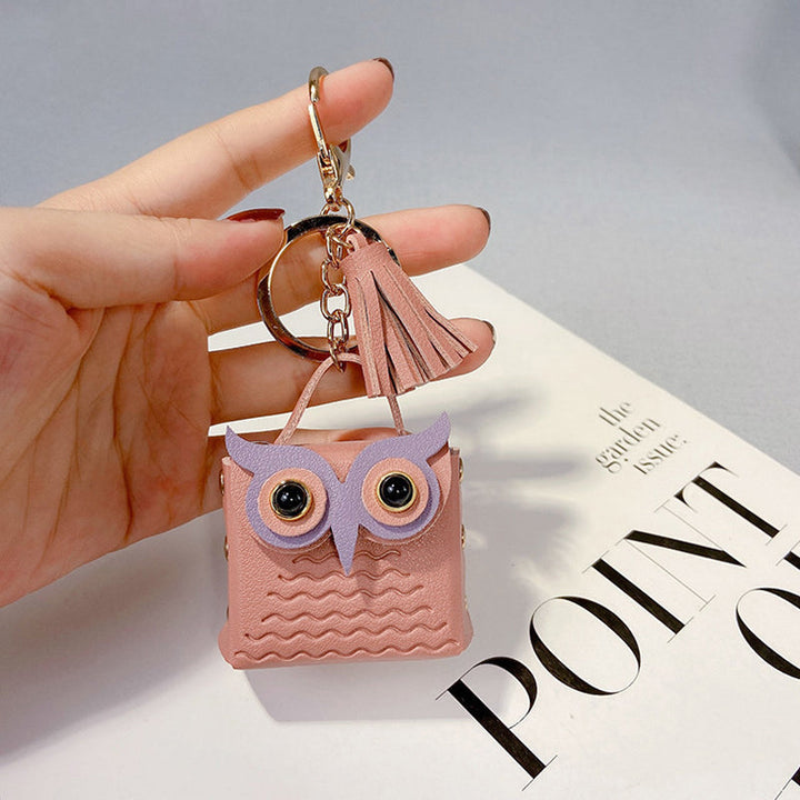 Back view of a mini handbag keychain, highlighting its complete design and storage feature