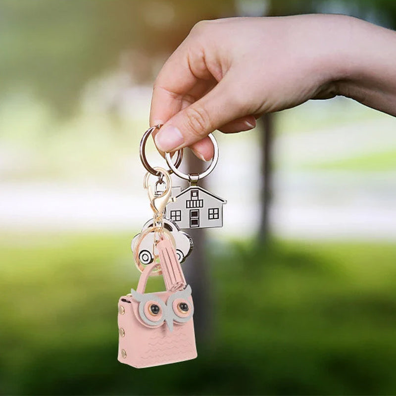 Close-up of the zipper on a mini handbag keychain, showing secure storage for tiny essentials
