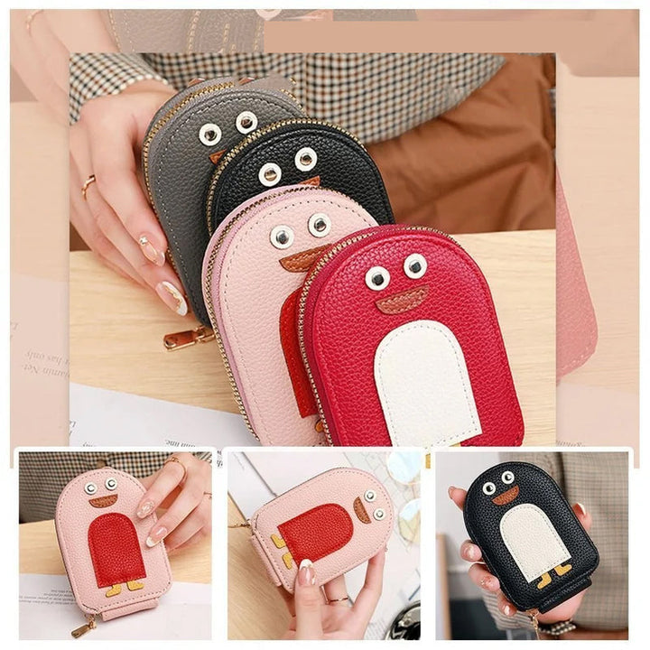 Cute penguin graphic on a durable PU leather card & coin wallet for women.
