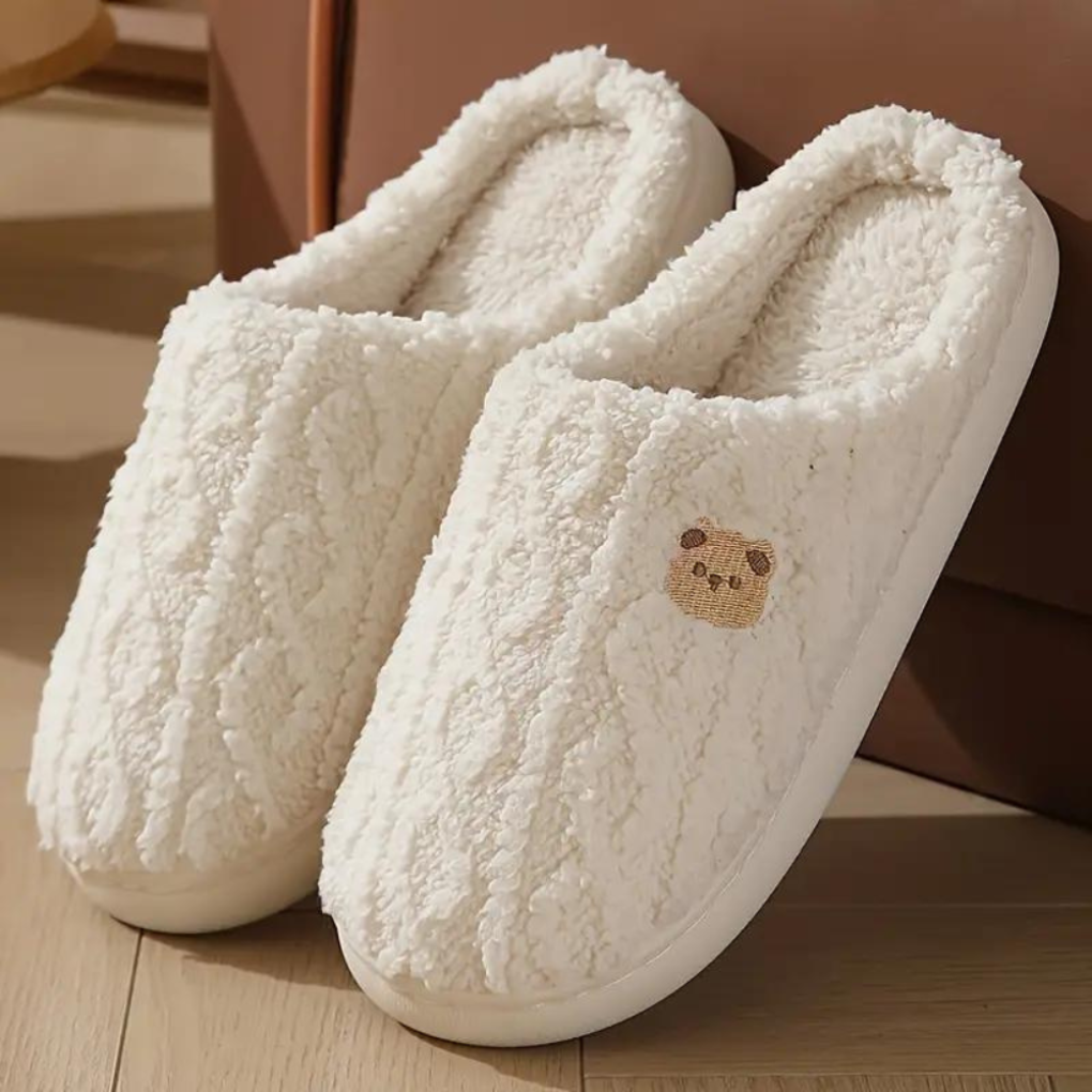 Cute pink plush slip-on indoor slippers for women, perfect for cozy spring lounging at home.
