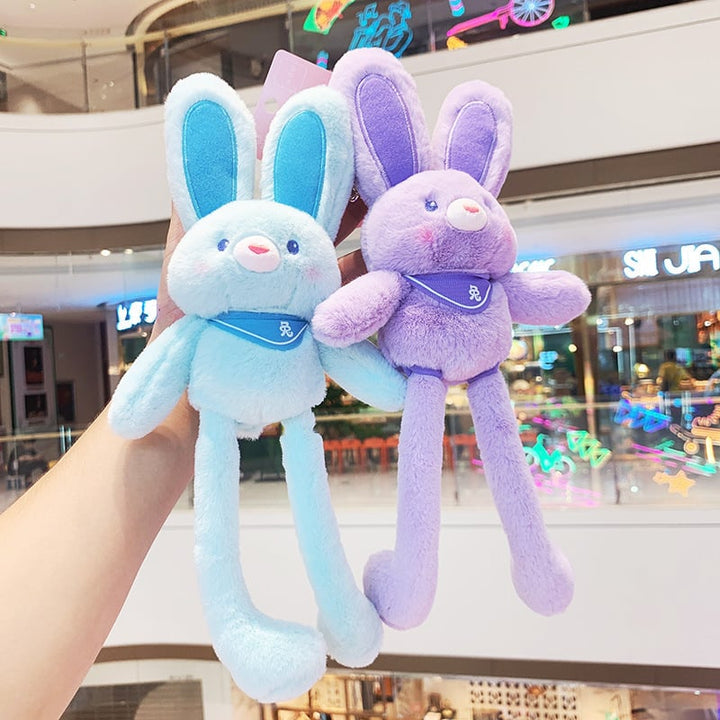 Cute rabbit plush toy keychain, perfect for kids' bags, featuring soft white fur & pink ears