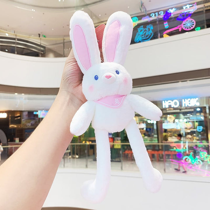 Close-up of a cute rabbit plush toy keychain, highlighting its soft texture & small size