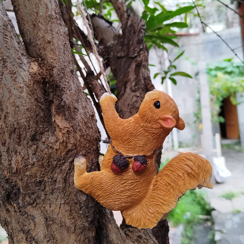 Cute squirrel tree hugger resin figurine, perfect garden decor for nature lovers.