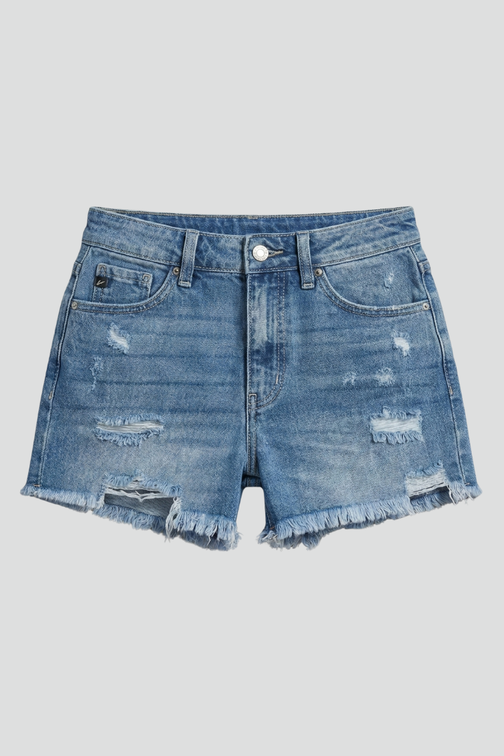 Dark blue distressed denim shorts for women, featuring a trendy frayed hem and mid-rise fit. Summer casual wear.