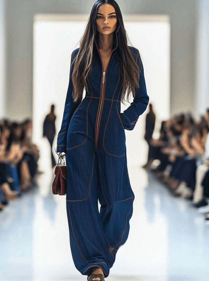 Comfortable women's dark blue wide leg jumpsuit. Features a practical zip front and elegant long sleeves.