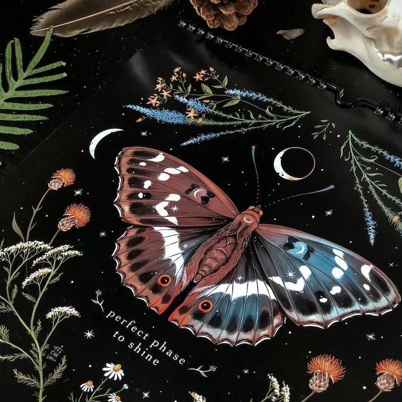 Dark Forest Lunar Calendar hanging on a wall, showcasing its unique nature-inspired design