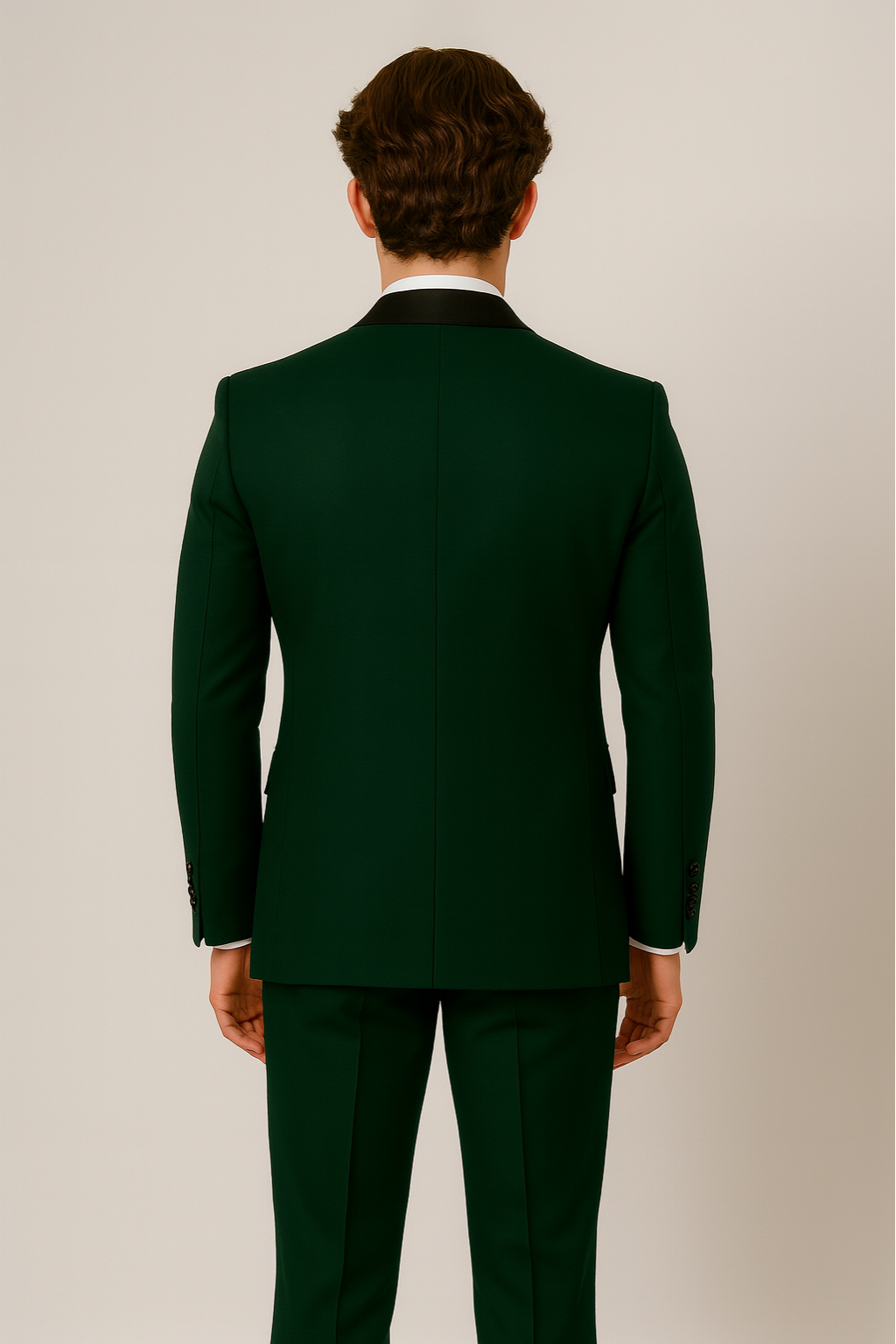 Dapper dark green three-piece men's suit. Includes vest, jacket, & trousers with unique contrast lapel detail.
