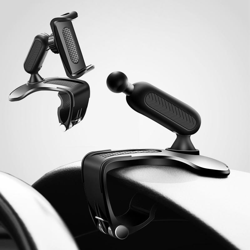 Universal car phone gadget attached to a dashboard, showing a smartphone in place