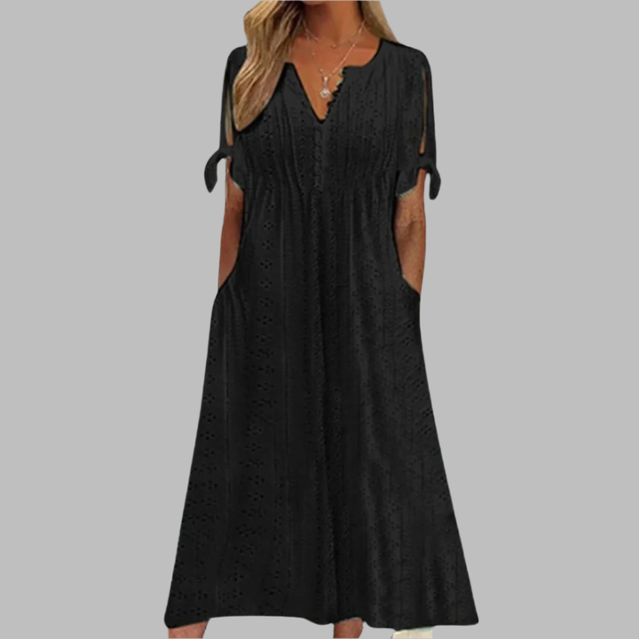 Flowy Boho Summer Midi Dress for women, featuring a delicate design, pockets, and short sleeves. Ideal for garden parties.