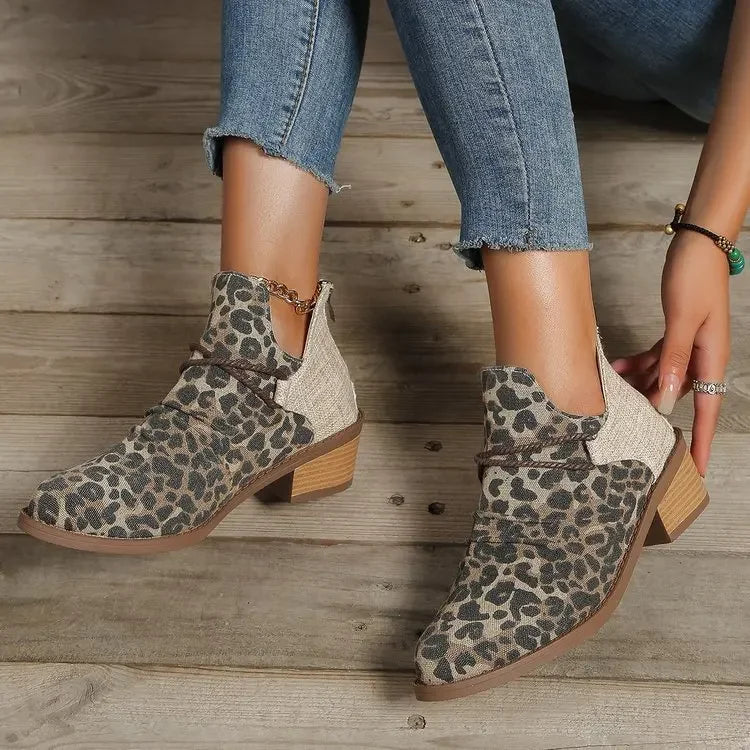 Two pairs of women's block heel boots: denim blue and leopard print woven textile