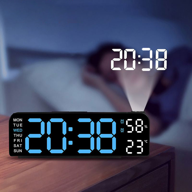 Digital LED wall clock mounted on a white wall, providing clear visibility of the time