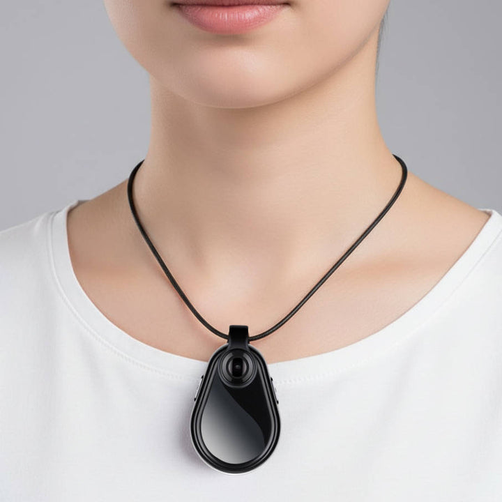 Wearable mini spy camera necklace, a discreet gadget for hidden video and audio recording on the go.