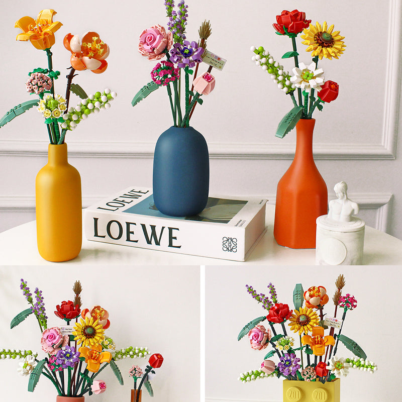 Various plastic flowers from a DIY botanical building kit, ready for assembly.