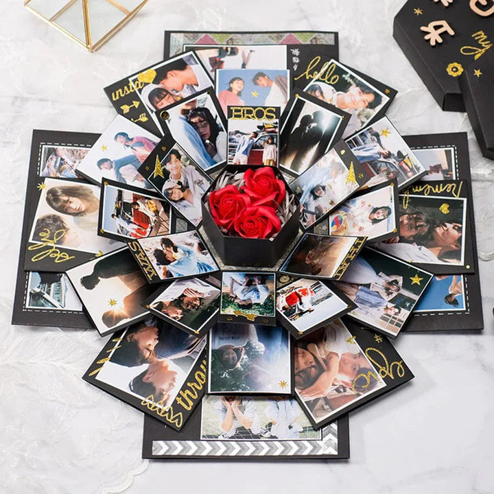 DIY giant explosion box kit components laid out: paper, stickers, embellishments for a handmade gift project
