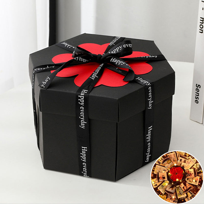 Detailed shot of an explosion box layer with pop-up elements, showcasing intricate scrapbook design & photo displays