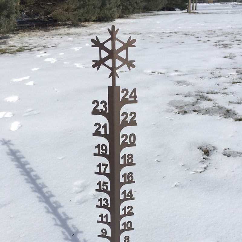 Unique metal snow gauge for gardens, combining outdoor decor with essential weather tracking