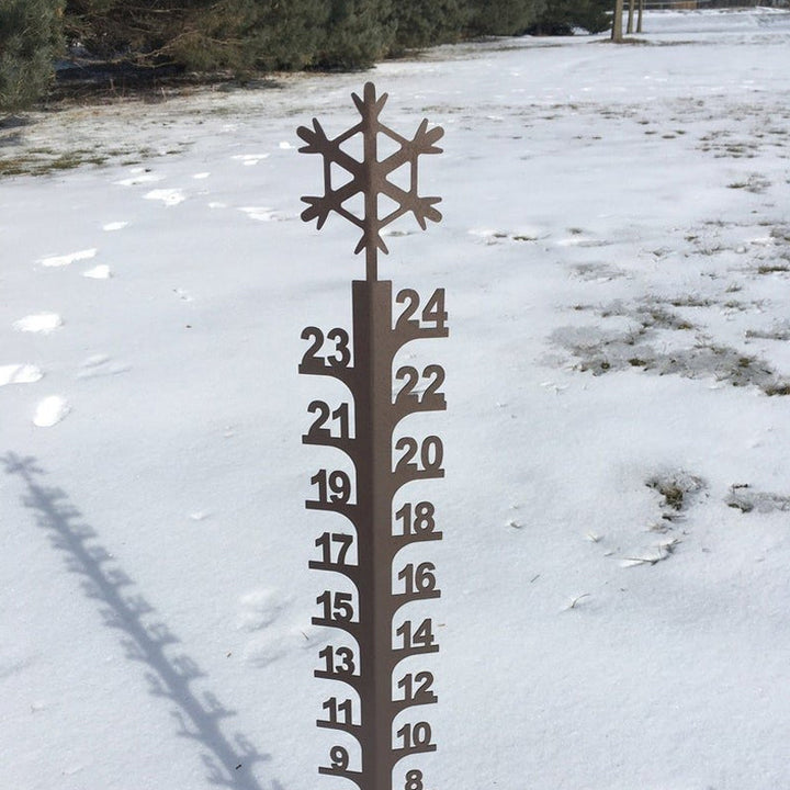 Unique metal snow gauge for gardens, combining outdoor decor with essential weather tracking