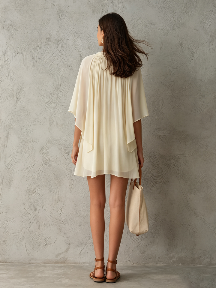 Casual women's beige mini dress with flowy cape sleeves & delicate gathered neckline. Great for brunch or a summer day.