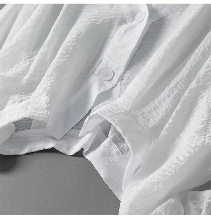 Casual women's summer top, a relaxed fit blouse in white, perfect for everyday elegance and warm weather fashion.