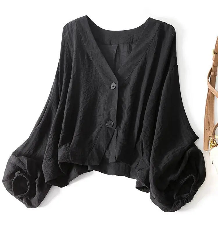 Lightweight white women's summer blouse with button detail, a comfortable relaxed fit top for warm weather fashion.