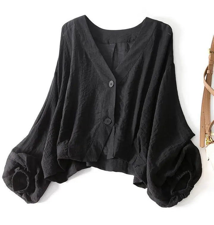 Lightweight white women's summer blouse with button detail, a comfortable relaxed fit top for warm weather fashion.