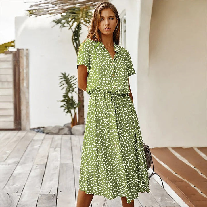 Elegant women's printed midi dress with unique pattern, versatile for casual outings & warm weather fashion.
