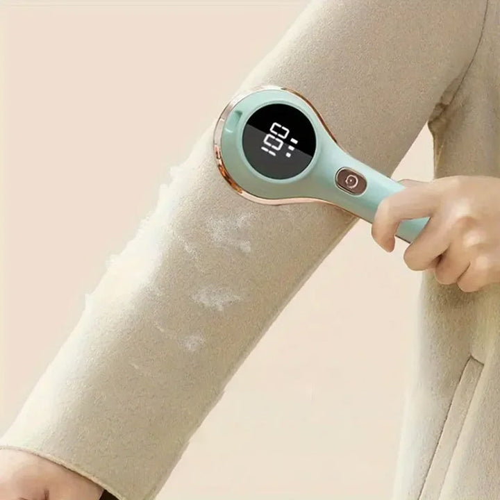 Electric lint remover, white and grey, showing power button and comfortable grip for garment care