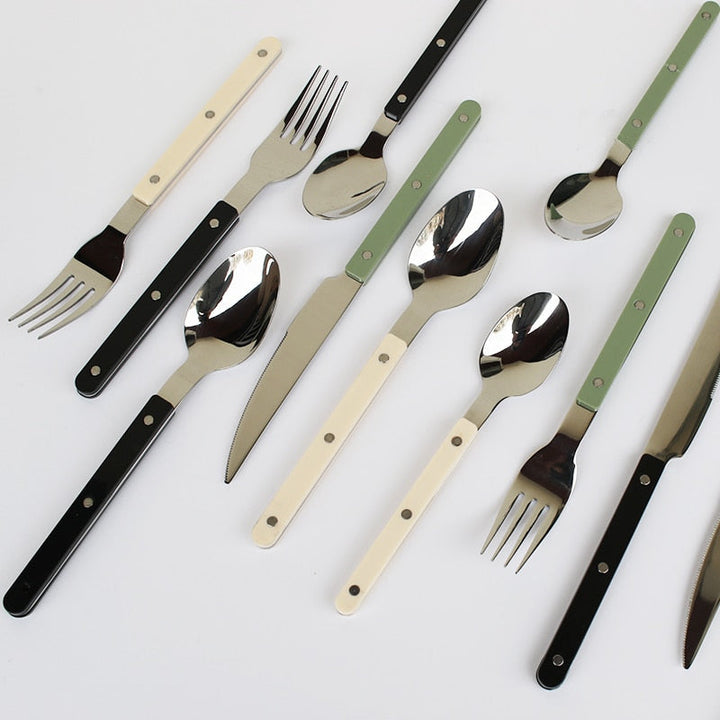 Sophisticated 24-piece engraved flatware set, perfect for elegant dining and kitchen table settings.